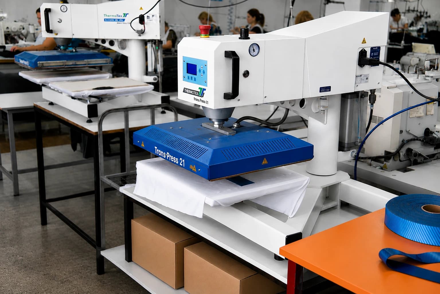 Heat transfer press applying a label to a garment